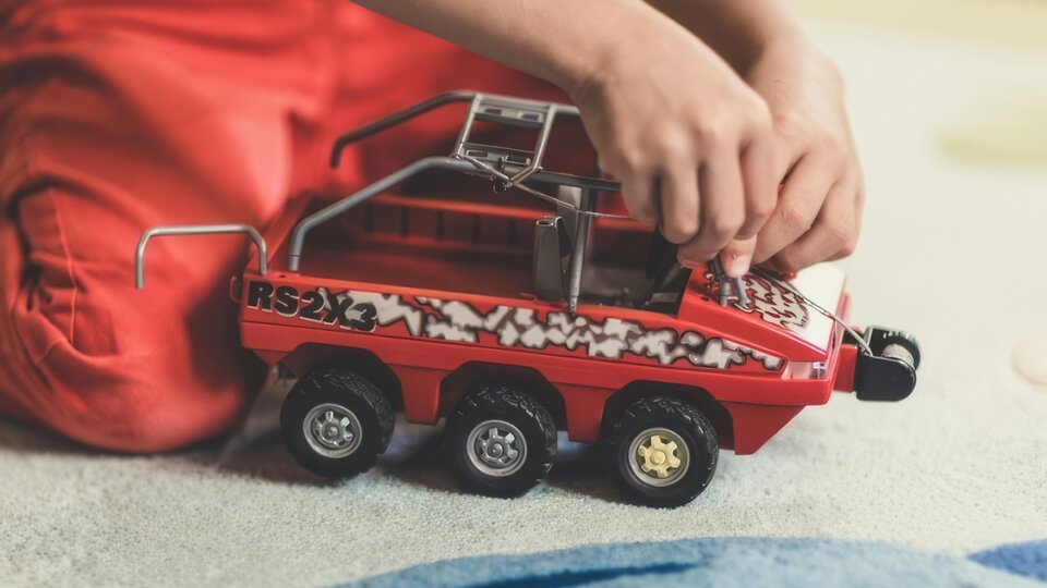 Child playing with toy.